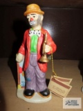 Emmett Kelly Jr Collection, clown with red coat and horn figurine, approximately 7-1/2 inches tall.