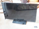 Toshiba, model 32L1400U, 32-in flat screen TV with remote.