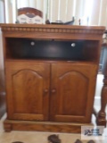 Oak flat screen TV stand on first floor.