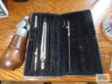 Lockstitch sewing awl by C.A. Myers and part of an antique drafting set.