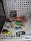 Variety of diecast and plastic cars including tractor, rock truck, NASCAR