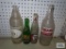 Four vintage advertising bottles
