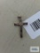 Gold colored cross etched with clear stone,marked 10K.