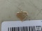 Gold colored heart shape pendant, marked 14K.