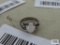 Silver colored ring with cloudy stone, marked Sterling.