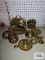 Various brass pieces including candlesticks, candy dish, napkin holder, candle holders