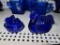 Cobalt blue miniature bunny on basket and swan