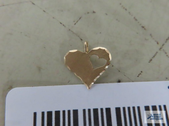 Gold colored heart shape pendant, marked 14K.