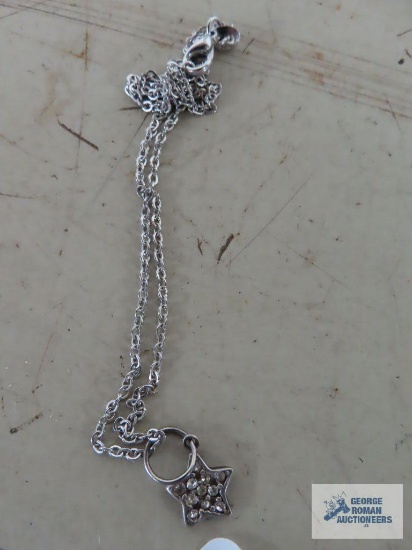 Silver colored star pendant, may be marked, on silver colored chain, marked 925.