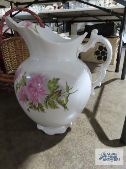 Large floral wash bowl made by Vienna number 178, has chip on top
