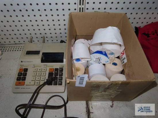 Texas Instruments electronic calculator with extra rolls