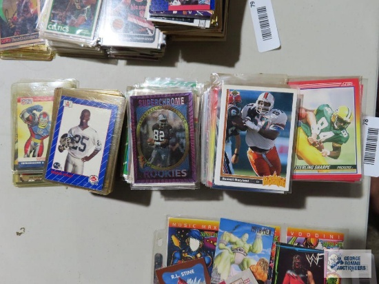 Assorted football cards and plastic and hard plastic cases
