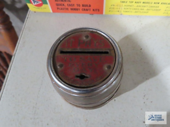 The Metropolitan Savings and Loan Co. metal barrel bank