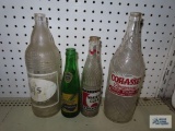 Four vintage advertising bottles