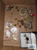 Assorted brooches, pins, and trinkets