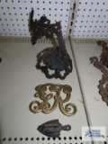 Antique oil lamp parts, 1949 Virginia Metalcrafters trivet, and miniature cast iron iron with stand