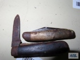Two assorted pocket knives. Both are rusty.