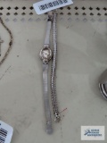 Victoria Rhein watch with silver colored band, missing glass on face and extra band