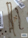 Gold colored cross pendant, marked 1/20 12K GF. Two gold colored necklaces, marked 1/20 12K GF.