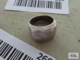 Silver colored solid band ring, marked 925.