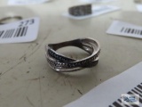 Silver colored ring with tiny clear and black stones, marked 925.
