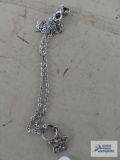 Silver colored star pendant, may be marked, on silver colored chain, marked 925.
