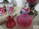 Cranberry etched glass bell and hobnail cruet. Bell is missing clapper.