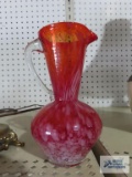 Orange art glass pitcher