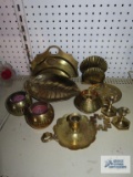 Various brass pieces including candlesticks, candy dish, napkin holder, candle holders
