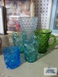 Variety of colored glassware and toothpick holder