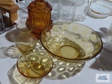 Amber glass candle holder, thumbprint bowl, vase, and small bowl