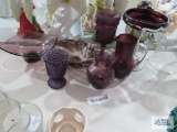 Purple glassware including candy dishes, candle holder, vase