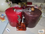 Two ice buckets and bar accessories