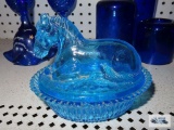 Light blue horse on nest, has chip on edge