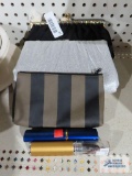 Clutch bags, pencil holder, and reading glasses in cases