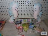 Fish and seahorse decorations and small seashell shelf
