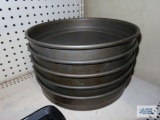 Five metal baking pans