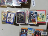 Assorted football cards and plastic and hard plastic cases