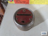 The Metropolitan Savings and Loan Co. metal barrel bank