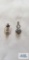 Silver colored pendant with pale blue stone, marked 925 and silver colored pendant with two yellow