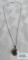 Silver colored pendant with grayish stone (Baroque Sea Pearl) on silver colored chain, both marked