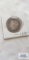 1899 Morgan one dollar coin, marked O