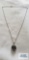 Silver colored pendant with multicolored stone on silver colored chain, both marked 925