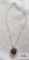 Silver colored heart-shaped locket silver colored chain, both marked 925, 9.3 G