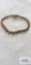 Gold colored bracelet with blue and clear stones (seller description sapphire and diamond), marked