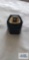 Gold colored ring with black stone and clear stone, marked 18KT HGE