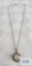Silver colored pendant with faux moonstone (no markings found) on silver colored chain marked 925
