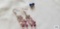 Purple stone dangle earrings and blue bead like earrings