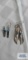 Silver colored feather earrings with stones, one marked Barney Sterling. The other one marked