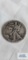 Walking Liberty half dollar coin, year not legible